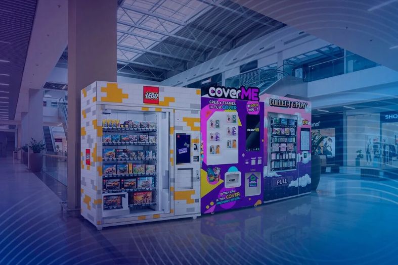 Distributori automatici Dedem per prodotti LEGO, cover personalizzate e carte collezionabili in un centro commerciale.